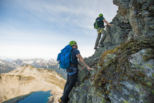 Low angle view of climbers scrambling Douglas Peak, British Columbia.