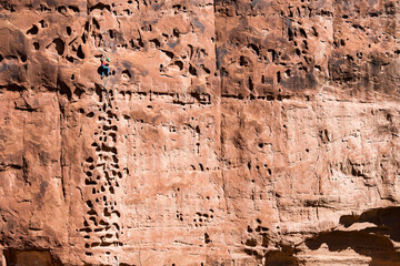 A woman climbing "Pocket Rocket" outside of Moab, Utah.