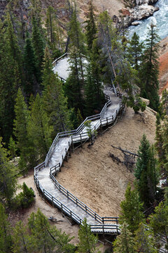 A narrow stair set winds down to a overlook of a river in Wyoming.