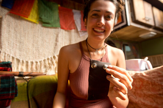 Woman holding homemade leather craft, New Mexico, USA
