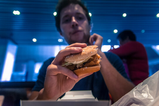 Man Holding Chicken Sandwich