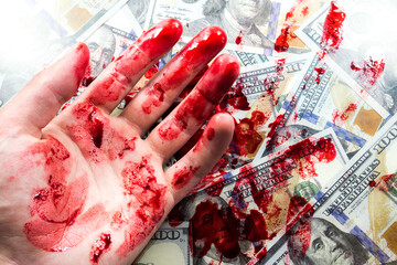 Dollars and hands in red blood stains. Arrested for illegal crime. Broken the law. Bribe...