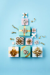 Christmas Decorations and Festive Gift Boxes on Blue background.