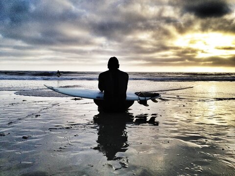 Surfer at sunset Cardiff state beach ca