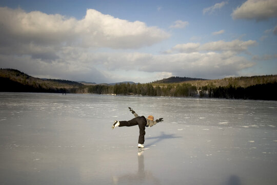 Ice skating on a pond