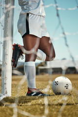 Soccer player, ball and athlete standing outdoor for training for a game on sports field practice for goal, motivation and energy. Football, fitness and athlete woman with sport skill for competition