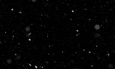 Falling snow isolated on black background