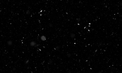 Obraz na płótnie Canvas Falling snow isolated on black background