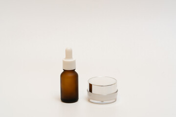 Mock-up dropper bottle with cream jar