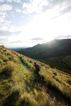 Woman mountain biking. Terrebone, Oregon, USA