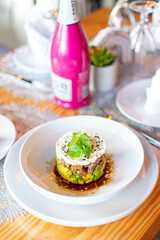 Tuna tartar. Tuna cut into small cubes mixed with soy and spicy and avocado bed

