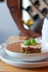 Tuna tartar. Tuna cut into small cubes mixed with soy and spicy and avocado bed

