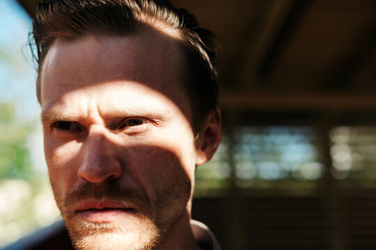 Portrait Of Young Attractive Man In Contrast Light