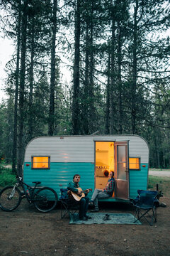 A couple camps in a trailer in Mt. Hood National Forest, OR.