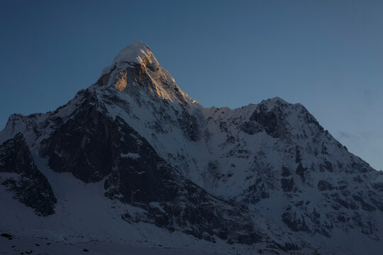Alpenglow on the summit of Ama Dablam in Nepal's Khumbu Valey.
