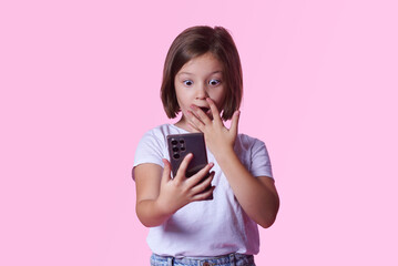 Shocked little girl receiving terrible news on her cell phone