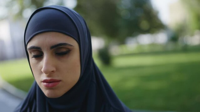 Portrait of Arab woman in hijab, unhappy with strict dress code, discrimination