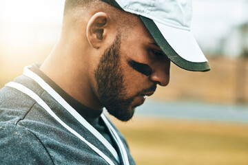 Baseball player, face and thinking of game strategy in fitness, workout and training on grass field pitch. Zoom, sports man or softball player in match exercise with stress, anxiety or mental burnout
