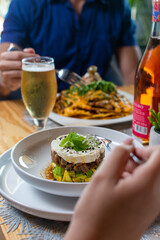 Tuna tartar. Tuna cut into small cubes mixed with soy and spicy and avocado bed

