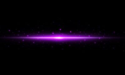 Obraz premium Beautiful light flares. Glowing streaks on dark background