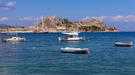 Kerkyra. Greece. View of the coastline and fishing boats on a sunny day.