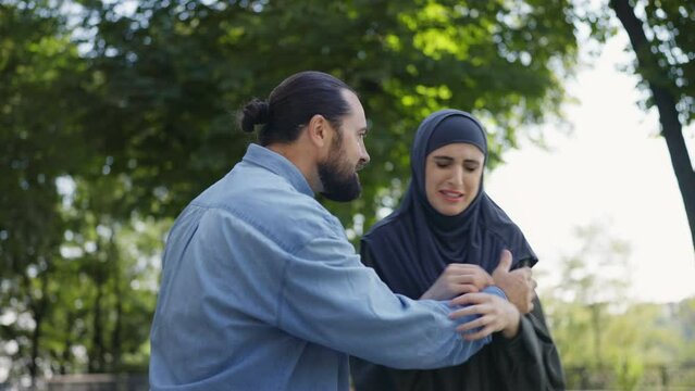 Aggressive muslim man bullying his wife, family abuse victim, gender oppression