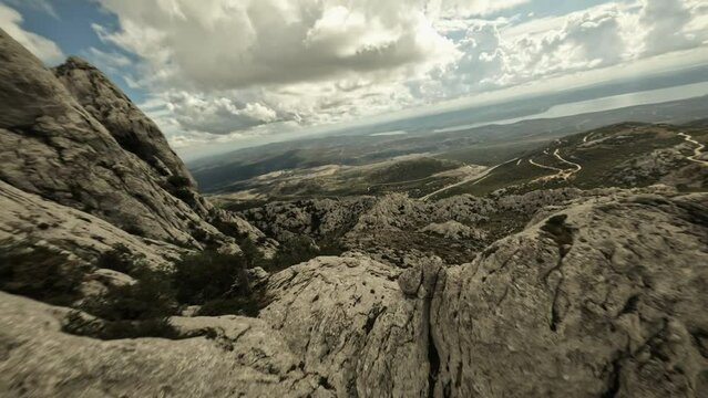 FPV drone diving Tulove Grede in the Velebit mountains, Croatia