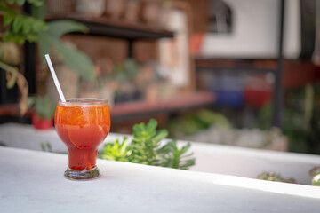 ice lemon tea in a glass on the white table.