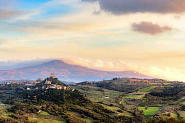 View over Castiglione d'Orcia in evening light in the Val d'Orcia in Tuscany, Italy, with Monte Amiata in the background..