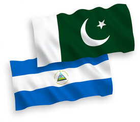 National vector fabric wave flags of Nicaragua and Pakistan isolated on white background. 1 to 2 proportion.