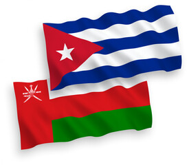 National vector fabric wave flags of Sultanate of Oman and Cuba isolated on white background. 1 to 2 proportion.