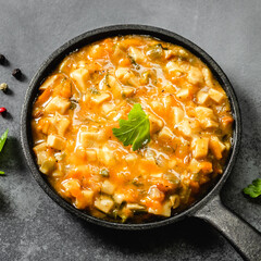 Healthy vegan mushroom stew in cast iron skillet. Top view, copy space.