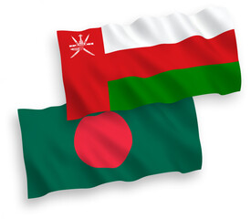 National vector fabric wave flags of Sultanate of Oman and Bangladesh isolated on white background. 1 to 2 proportion.
