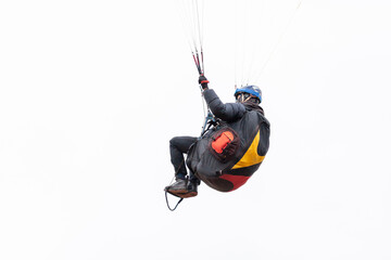 Skydiving extreme sports- parachutist with a parachute unfolded. The sportsman flying on a...