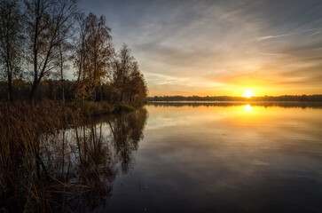 Fototapeta na wymiar Sunrise over the swedish lake - October month