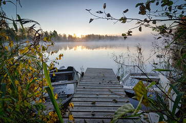 Wooden bridge with boats - morning view in October