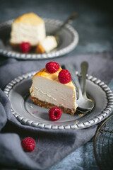 baked cheesecake, topped with fresh raspberries 