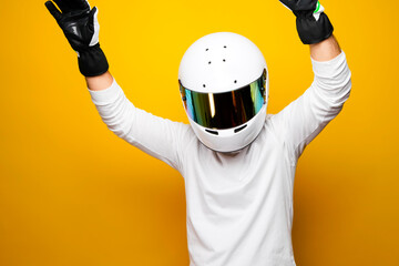 A Helmet Wearing Race Car Driver celebrating on the podium after winning the race. Male Racer on...