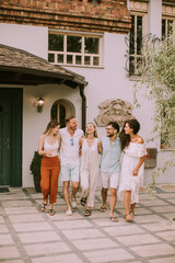 Fototapeta premium Group of happy young people having fun outdoors