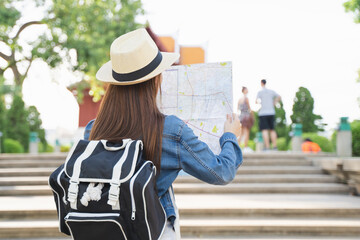 Backpacker journey destination concept, Young tourism student traveling city tour at city street in Southeast Asia during the summer vacation trip.