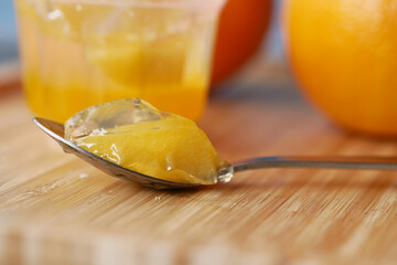 colorful orange flavor jelly on plate on table,