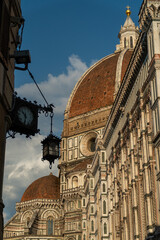 Beautiful picture of an old clock in front of the cathedral santa maria in florence