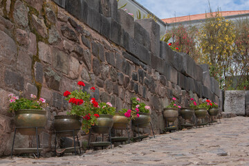 Flower garden in pots at Qorikancha, Church and Convent of Santo Domingo de Guzman in Cusco. 
