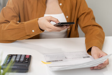 Convenience online internet banking, asian young woman hand in payment bill, spending by scan qr code, use phone, mobile to transfer or pay money of credit card without cash. Technology of financial.