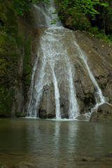 Naklejka premium waterfall in the woods