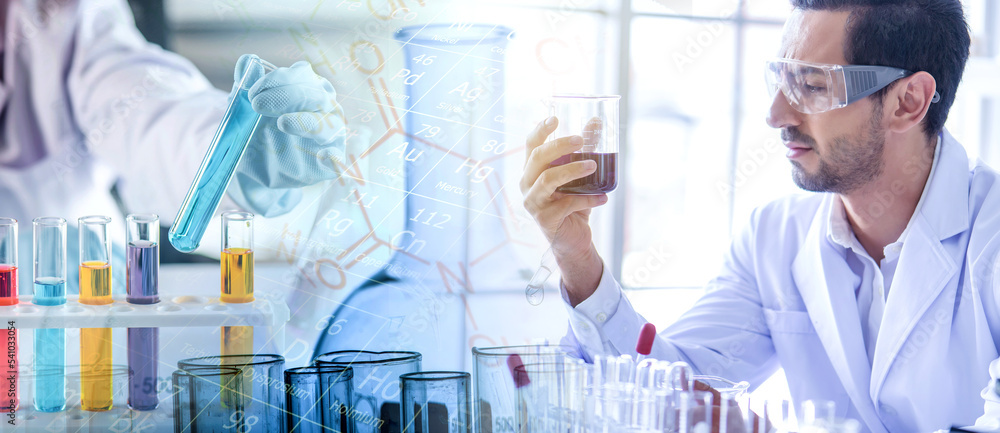 Wall mural attractive scientist man testing chemical sample in flask at laboratory with lab glassware backgroun