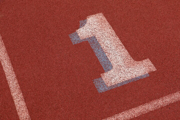 First lane on an athletics track showing a number one