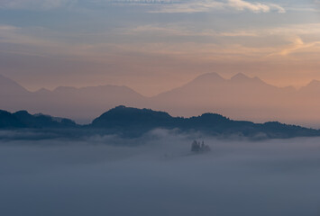 Cerkev Sveti Tomaž (St. Thomas Church) near Škofja Loka, Slovenia. Misty morning and sunrise