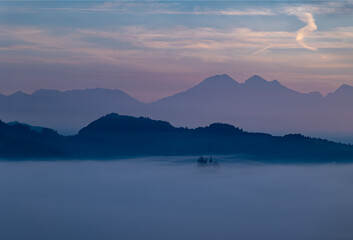 Cerkev Sveti Tomaž (St. Thomas Church) near Škofja Loka, Slovenia. Misty morning and sunrise