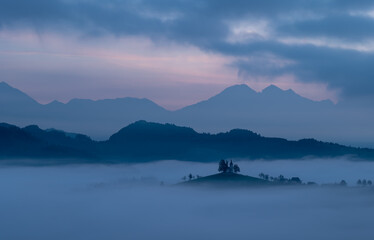 Cerkev Sveti Tomaž (St. Thomas Church) near Škofja Loka, Slovenia. Misty morning and sunrise